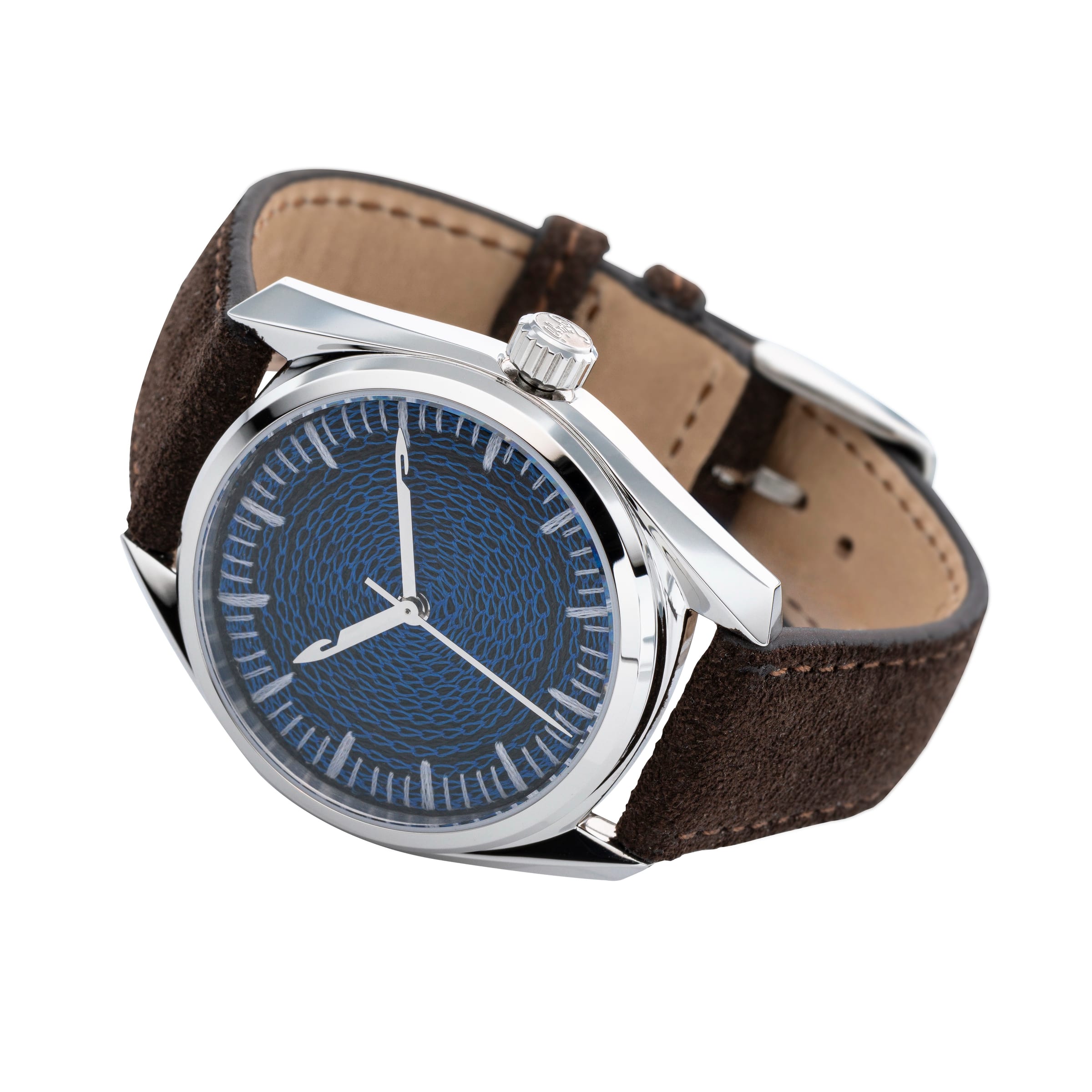 Three-quarter studio view of the CORNELY watch on white, navy chenille dial, umber suede strap