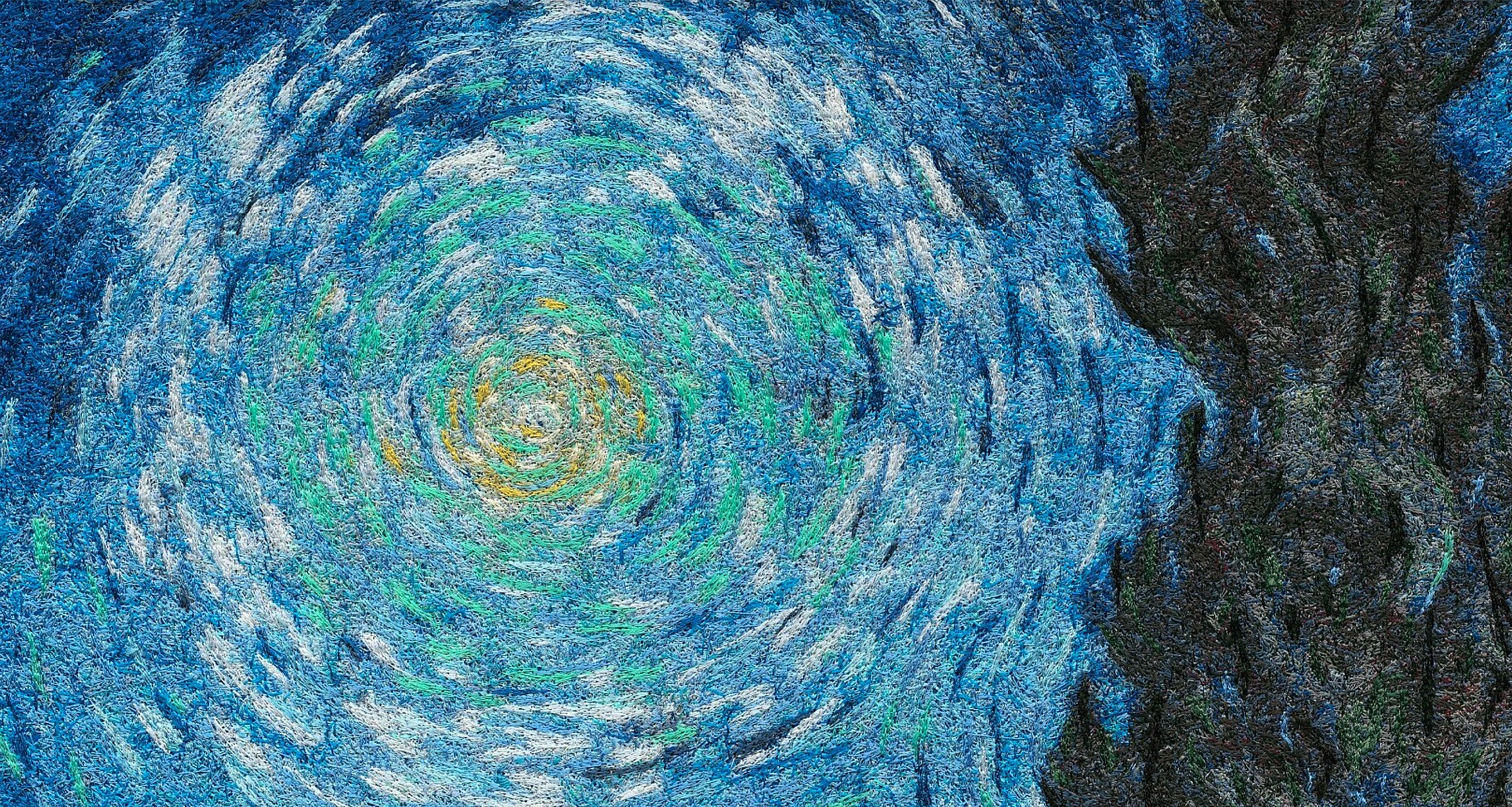 Macro of a chenille-embroidered reproduction of Van Gogh's swirling sky