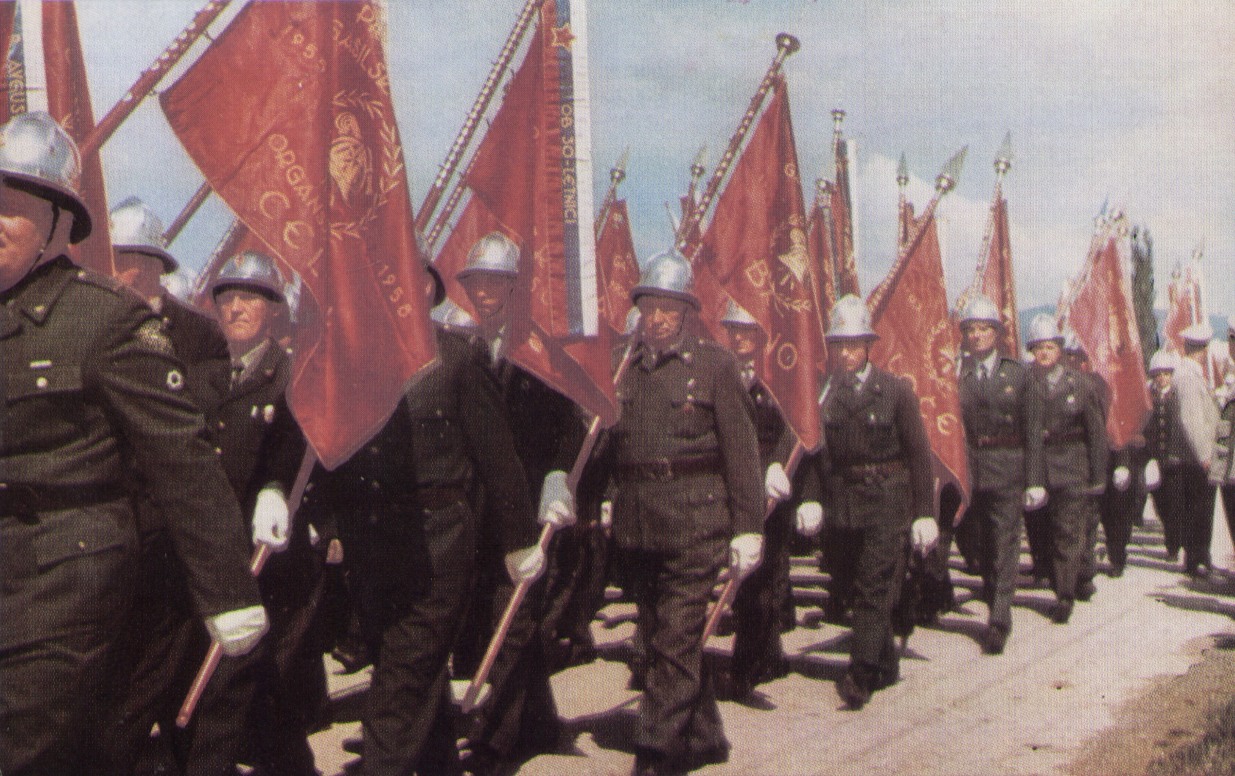Firefighters' parade carrying Ercigoj-embroidered ceremonial banners