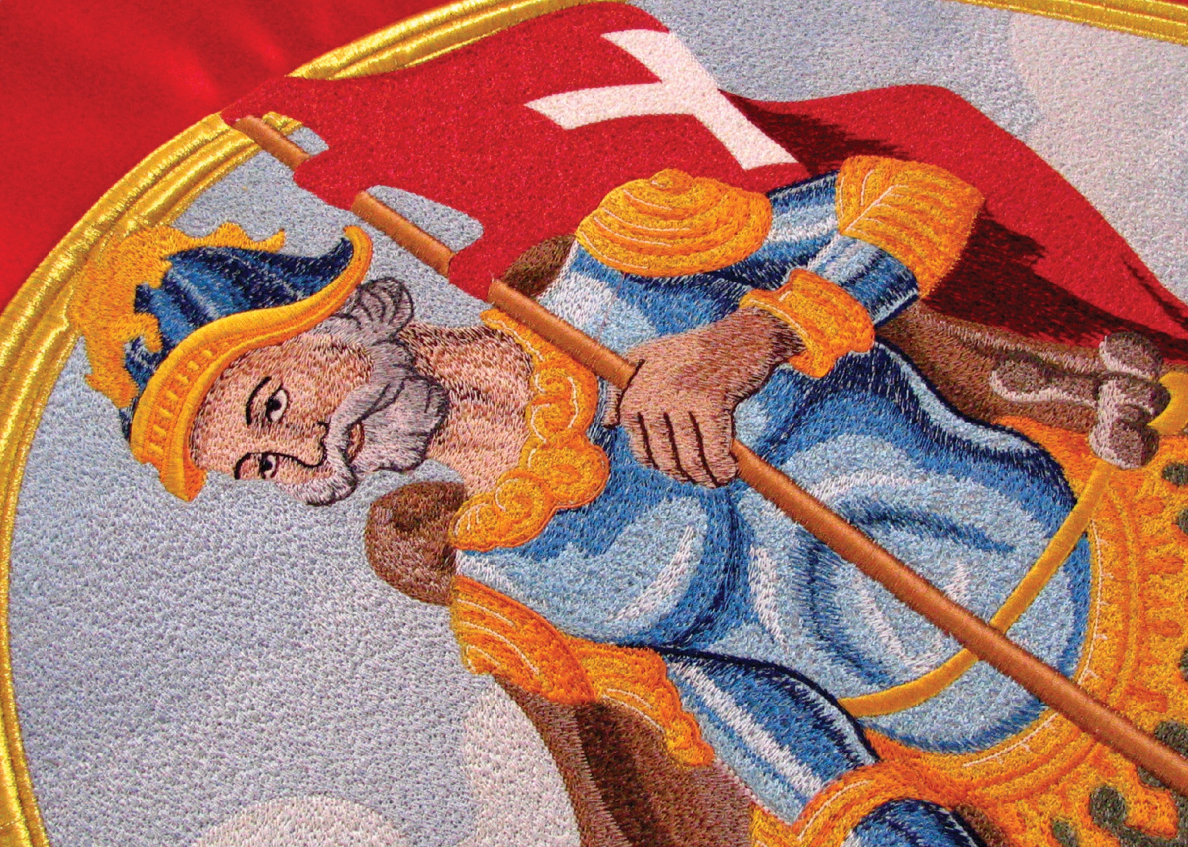 Macro detail of a chenille-embroidered flag-bearer figure, thread work, 2010