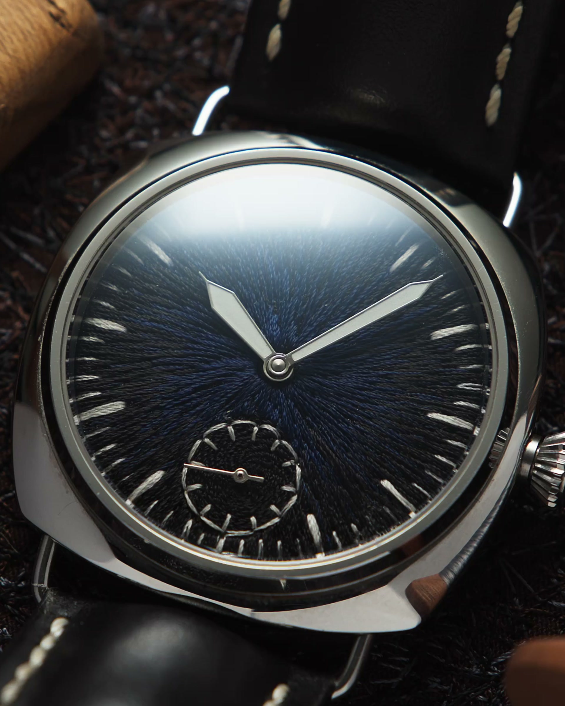 Macro of JACKART's dark blue chenille dial